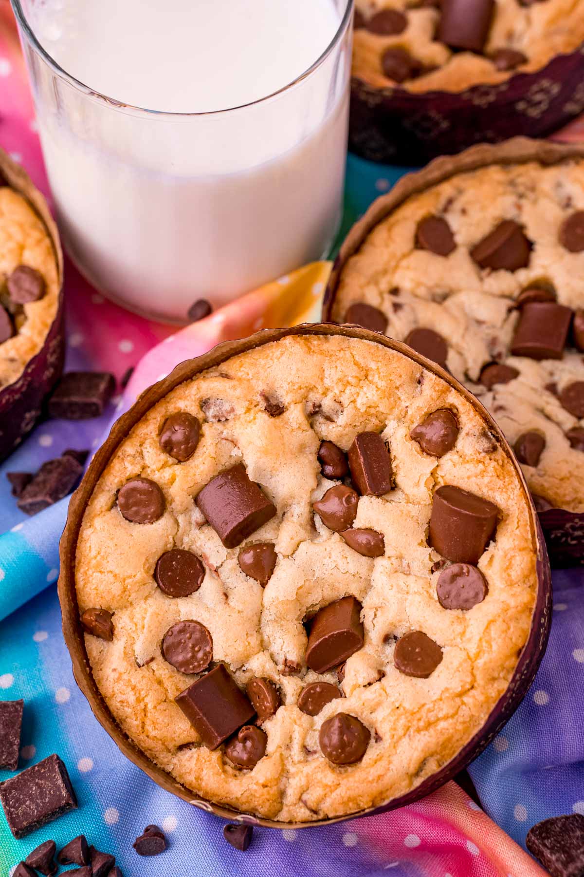 Close up photo of Disney num num cookies with a glass of milk.