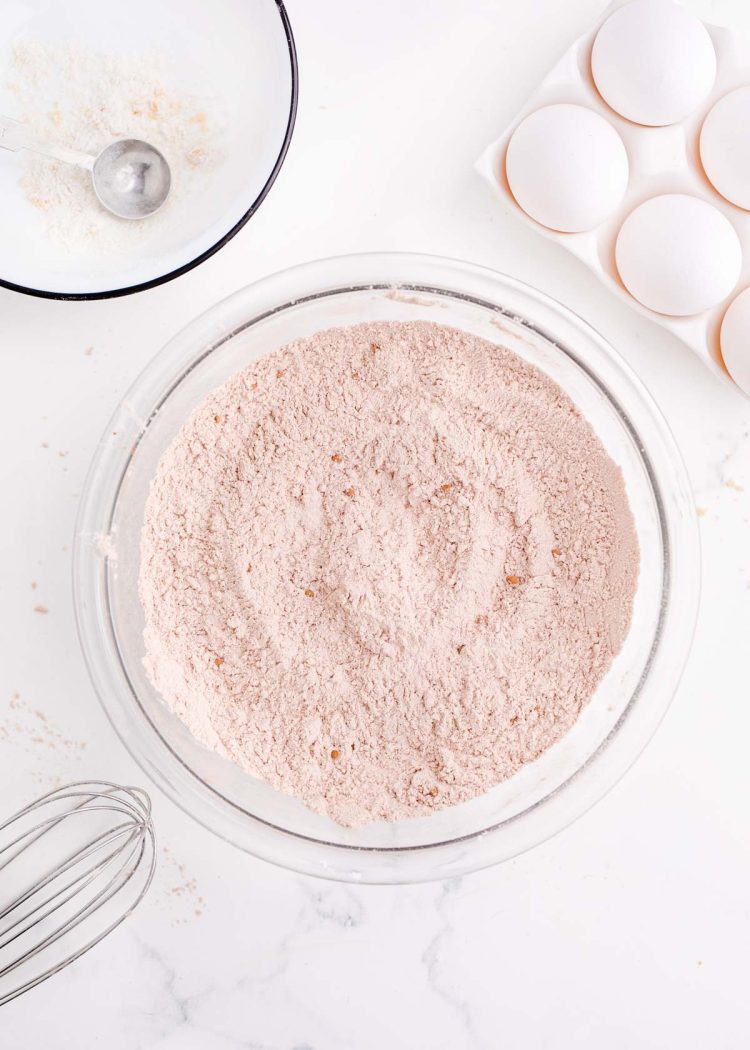 Dry baking ingredients mixed together in a glass mixing bowl.