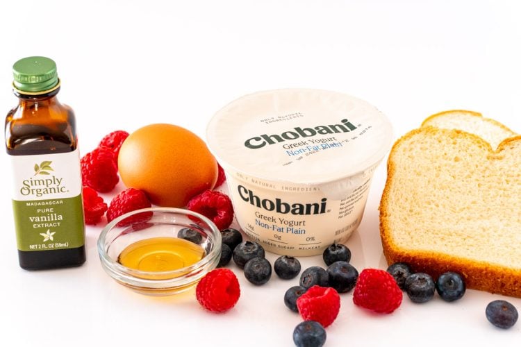 Ingredients to make custard toast on a white surface.