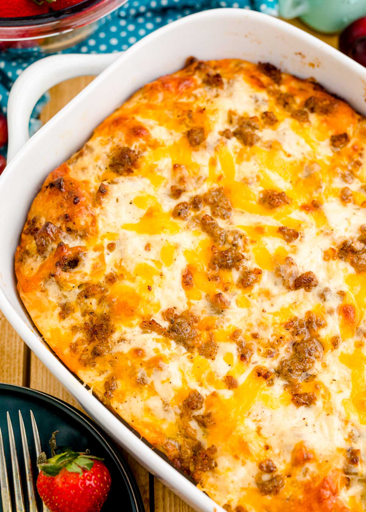 Close up of biscuits and gravy casserole in a white dish.