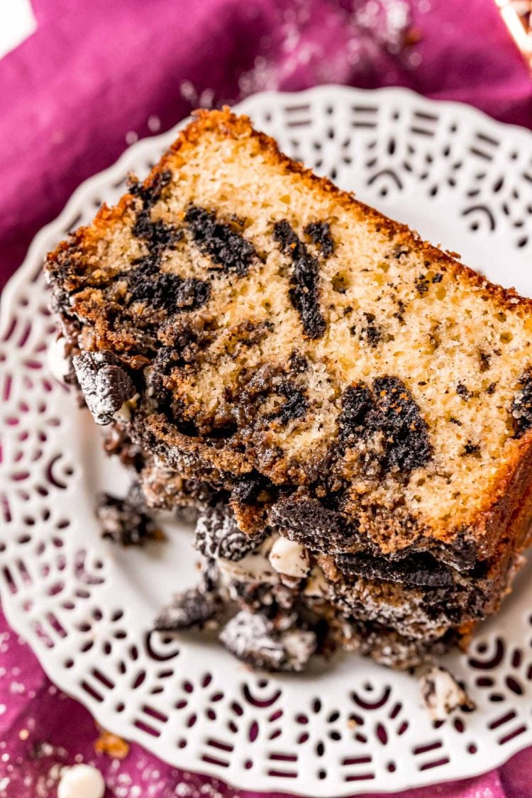 Oreo Crumb Cake on a white plate on a purple napkin.