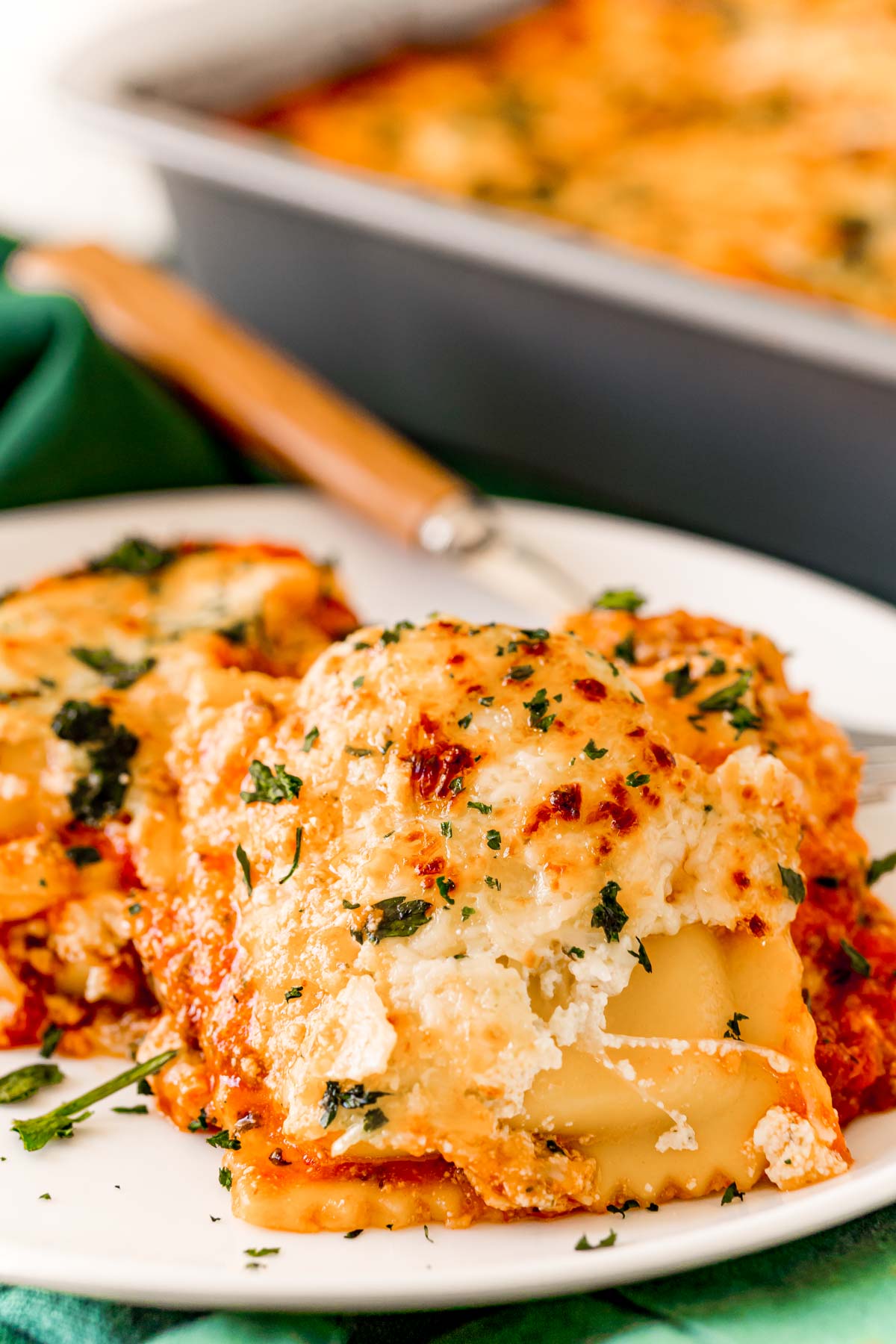 Ravioli lasagna on a white plate.