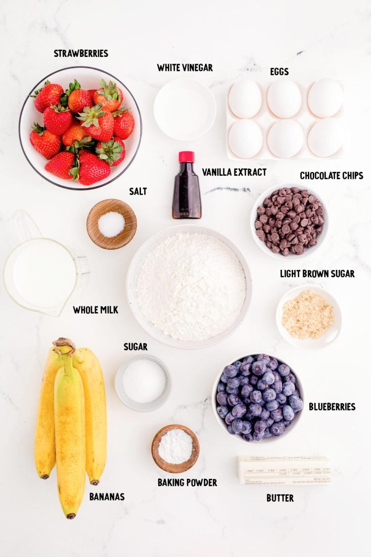 Ingredients to make sheet pan pancakes on a marble surface.