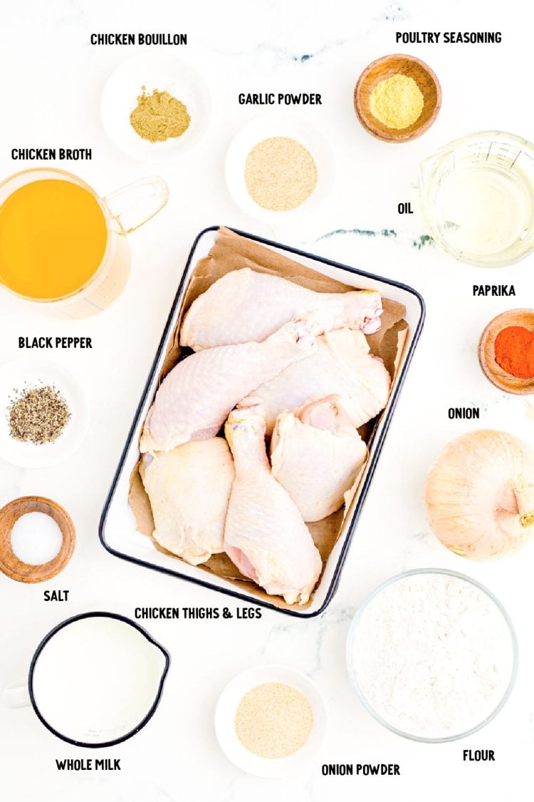 Overhead photo of ingredients prepped to make smothered chicken on a marble surface.