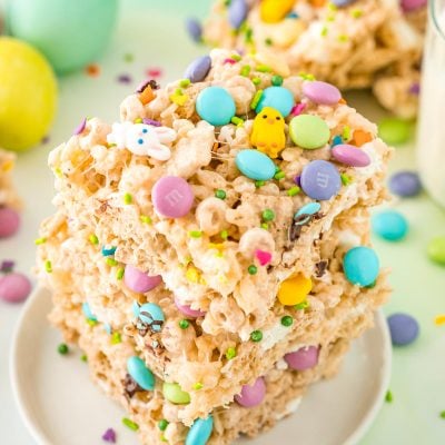 Close up photo of a stack of three Easter rice krispie treats on a small white plate.