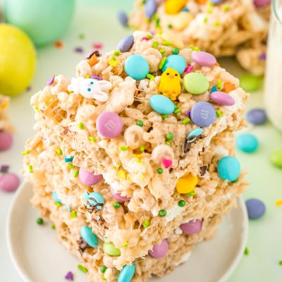 Close up photo of a stack of three Easter rice krispie treats on a small white plate.