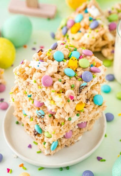 Close up photo of a stack of three Easter rice krispie treats on a small white plate.