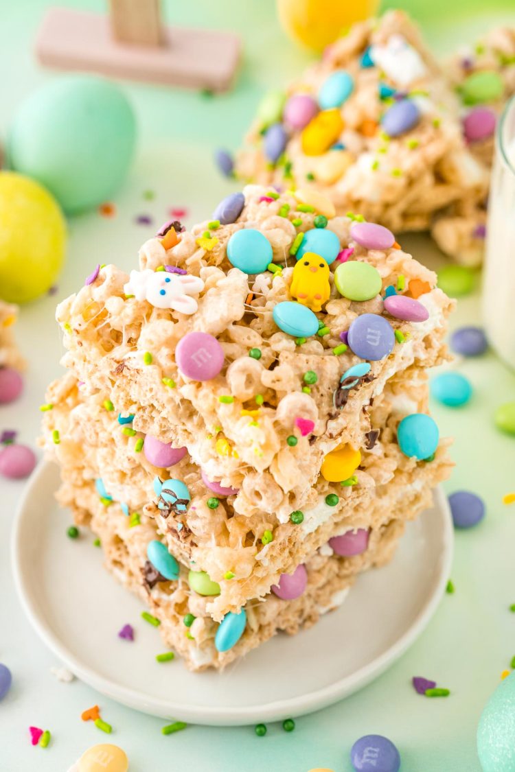 Close up photo of a stack of three Easter rice krispie treats on a small white plate.