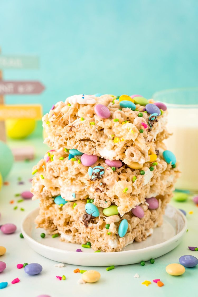 Close up photo of a stack of three Easter rice krispie treats on a white plate.