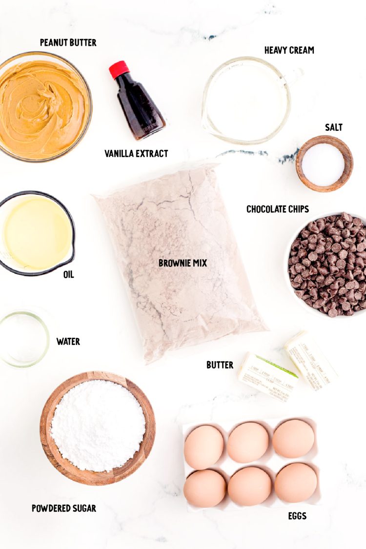 Ingredients to make buckeye brownies prepped on a marble counter.