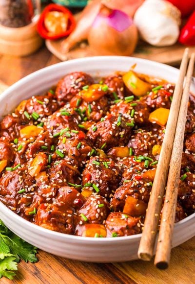 This Chicken Manchurian is a flavor-packed dish that's made with deep-fried ground chicken balls, Tamari, red chili pepper, and ginger! Prep this mouthwatering dinner option in just 15 minutes!