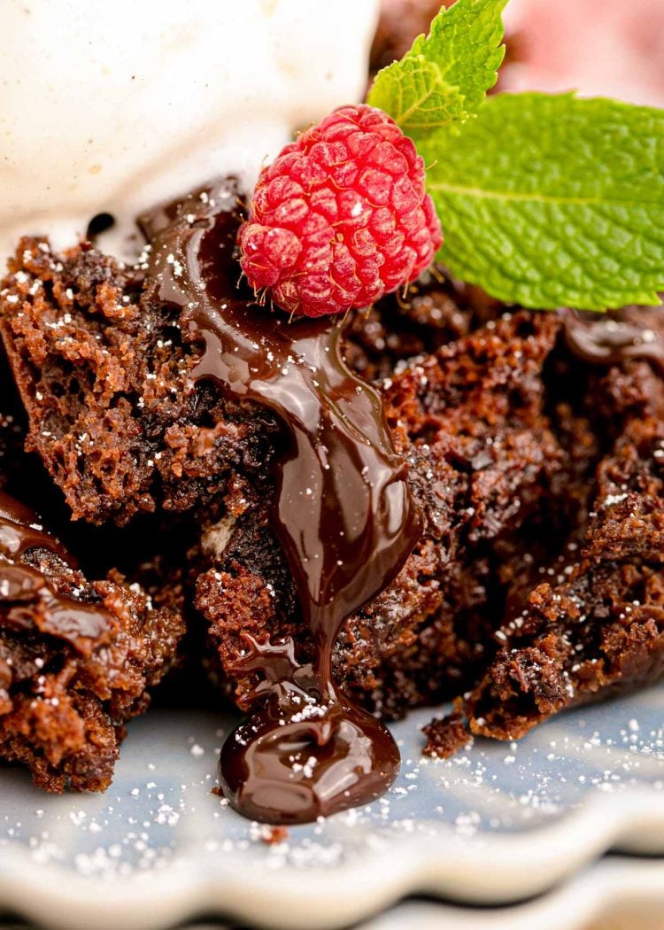 Close up of chocolate crock pot cake on a blue plate.