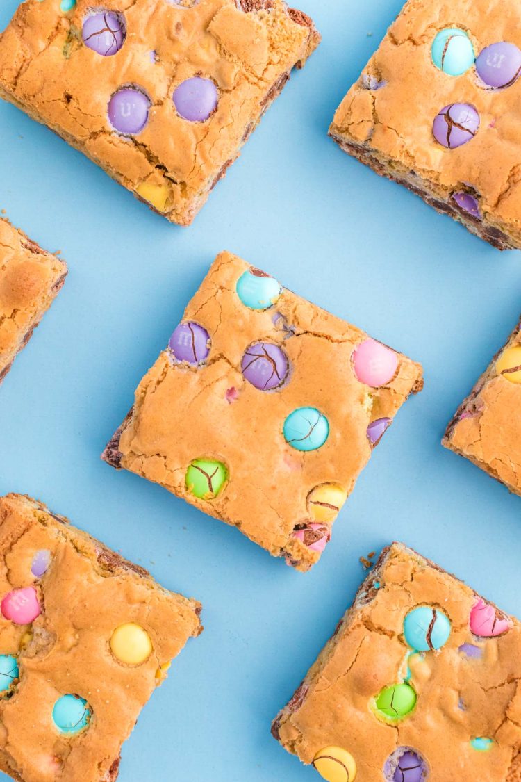 Easter blondies on a blue surface.