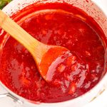 Close up photo of strawberry puree in a pot.