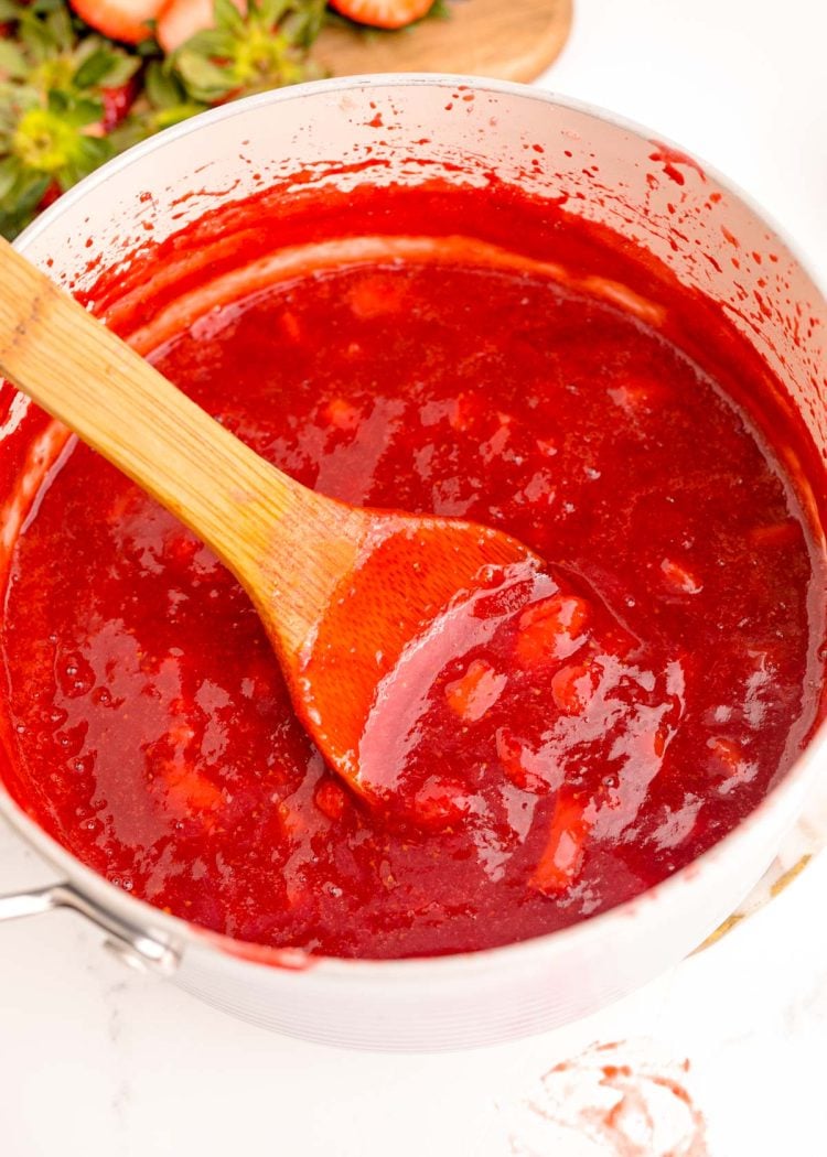 Close up photo of strawberry puree in a pot.