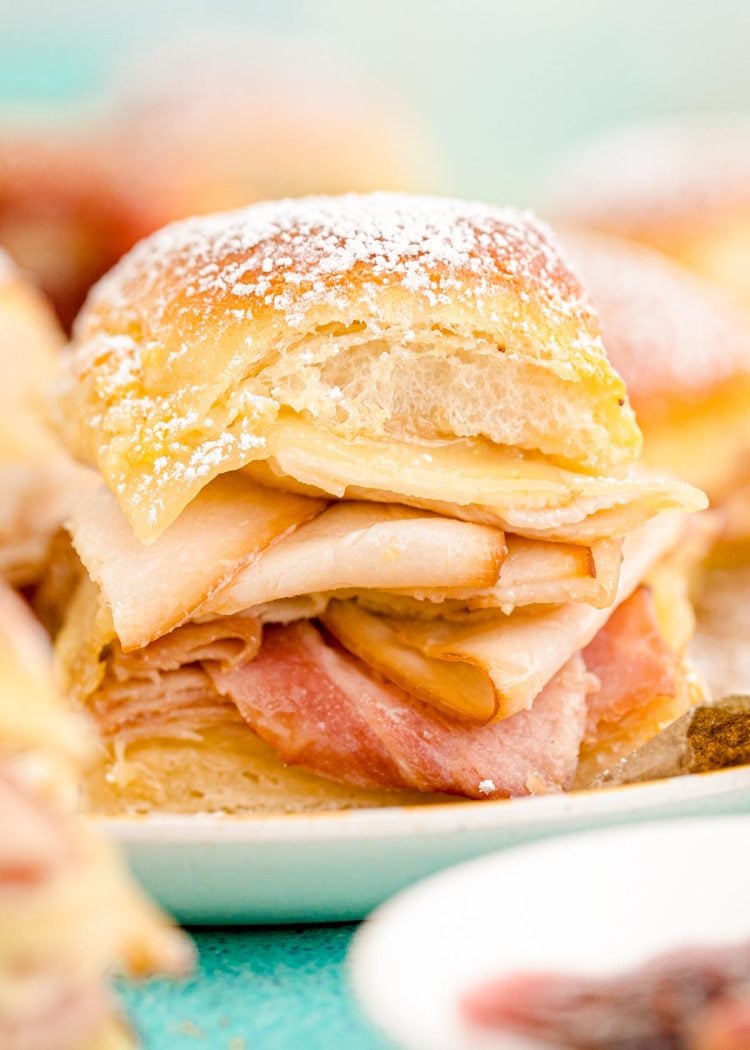 Close up photo of monte cristo sliders on a plate.
