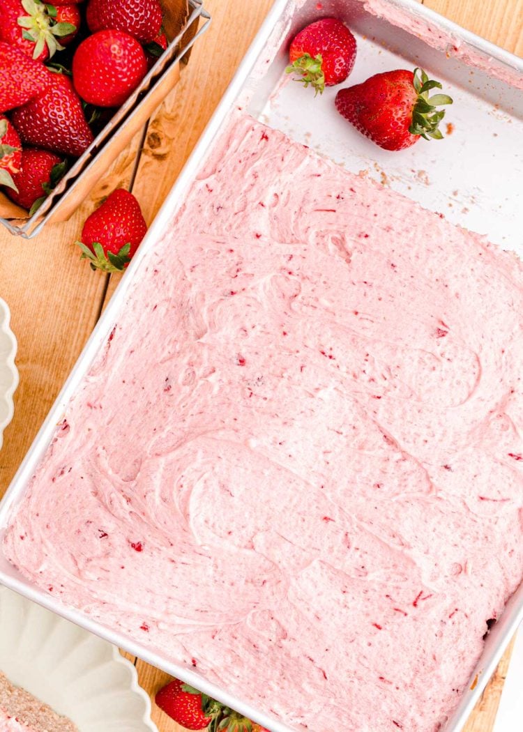 Strawberry sheet cake in a baking pan.