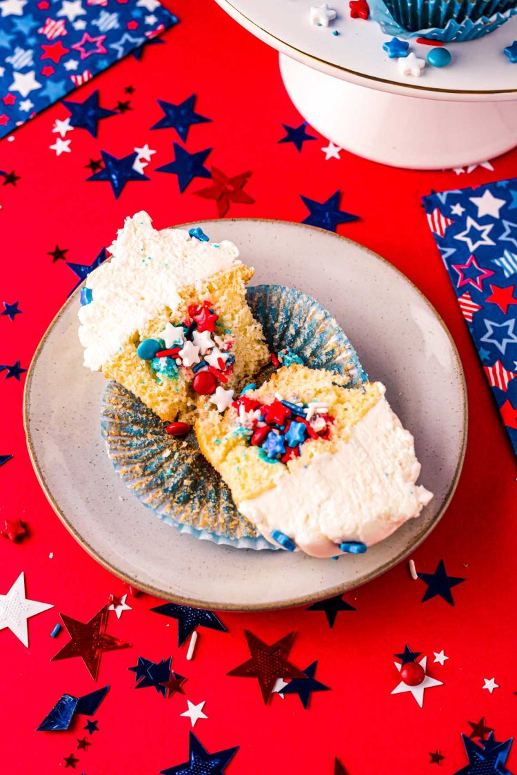 4th of July cupcake cut in half to reveal sprinkles inside.