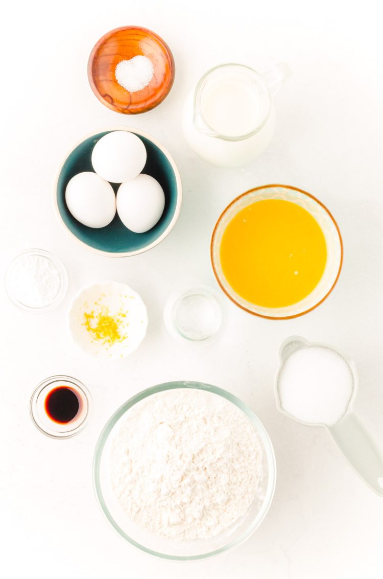 Ingredients to make Belgian waffles on a marble counter.