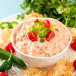 Close up photo of a white bowl with boat dip in it.