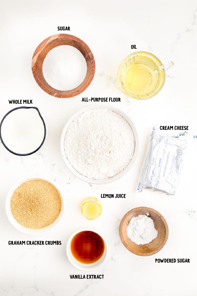Ingredients to make fried cheesecake balls on a marble surface.