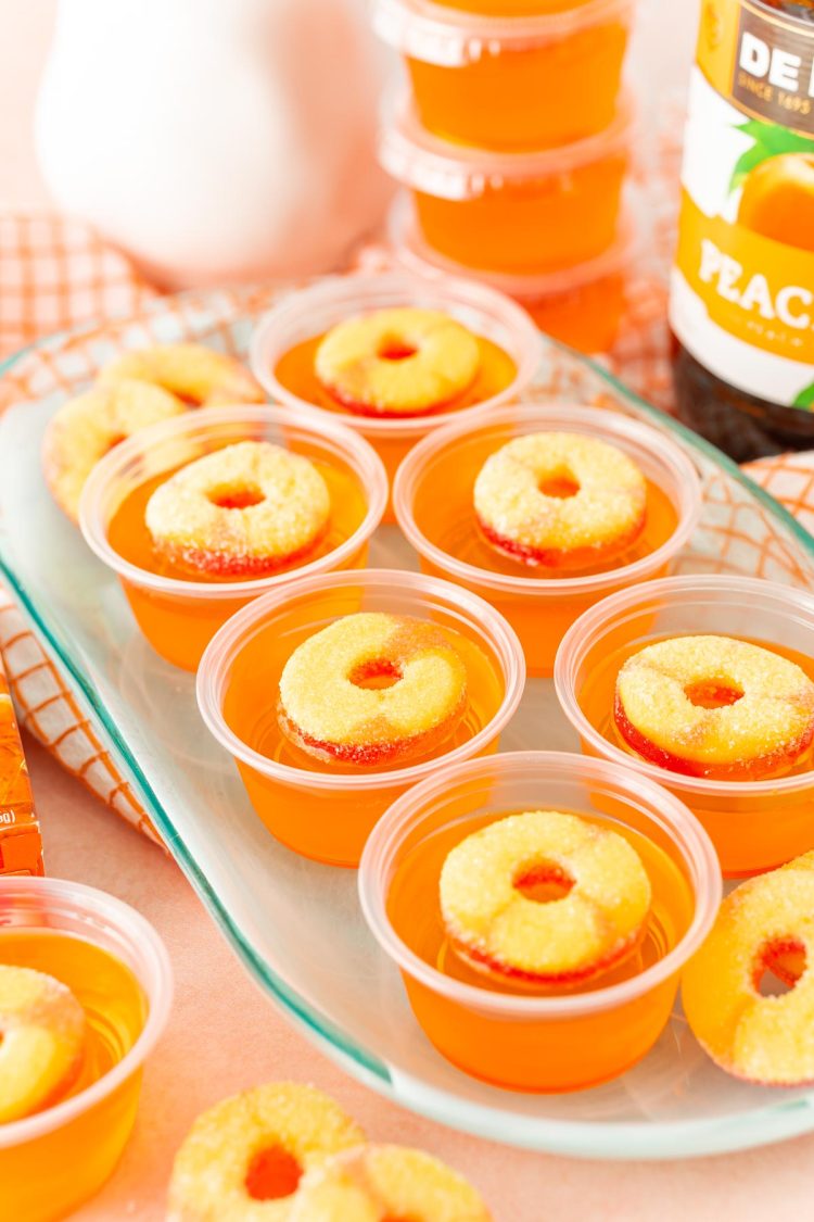 Fuzzy Navel Jello Shots on a blue plate.