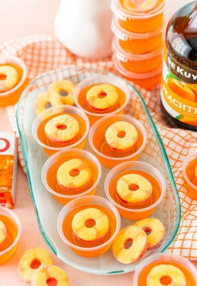 Fuzzy Navel Jello Shots on a blue plate.