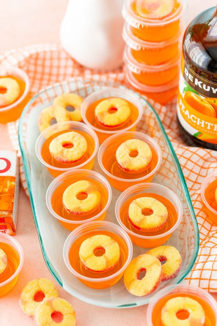 Fuzzy Navel Jello Shots on a blue plate.