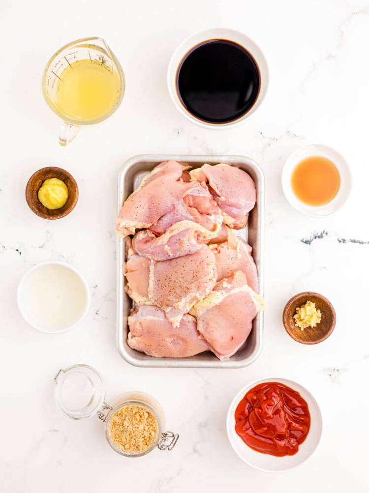 Ingredients to make huli huli chicken prepped on a marble counter.