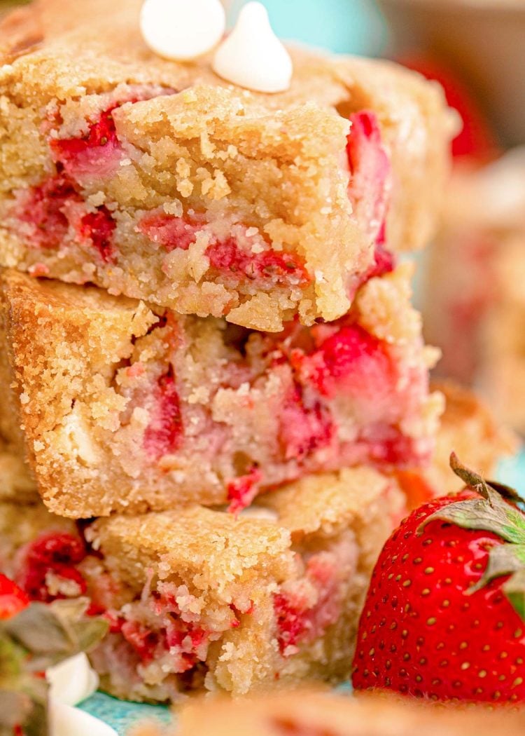 Close up photo of a stack of three strawberry blondies.