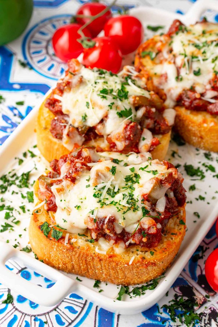 Close up photo of Texas toast sloppy joes on a white plate.