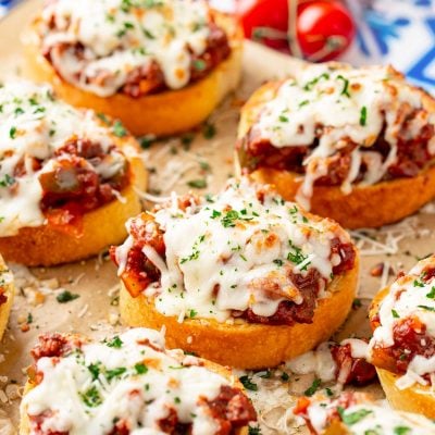 Texas Toast Sloppy Joes on a piece of parchment paper on a baking sheet.