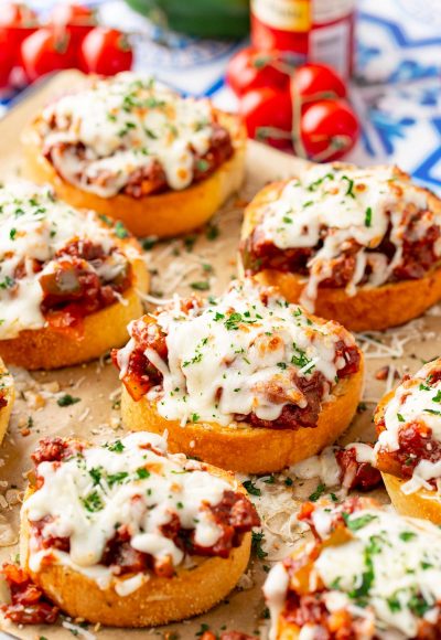 Texas Toast Sloppy Joes on a piece of parchment paper on a baking sheet.