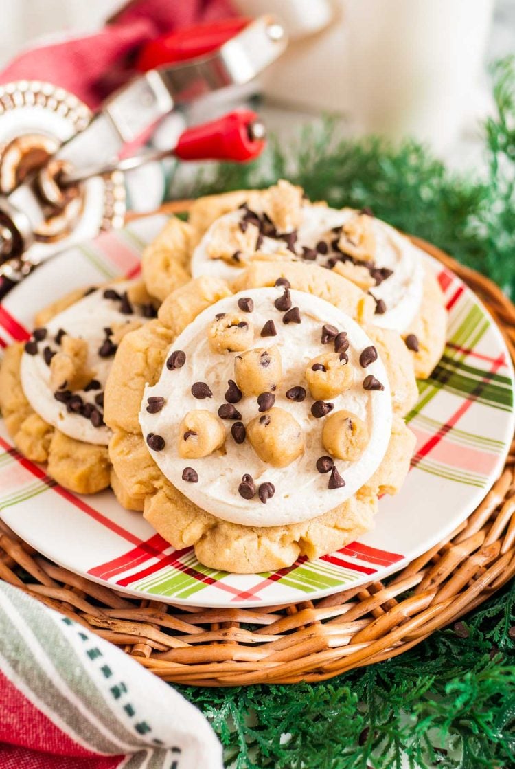 Close up of crumbl copycat cookie dough cookies on a red and green plaid plate.