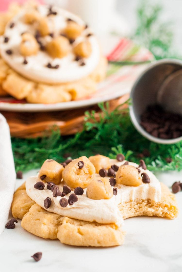 A crumbl copycat cookie dough cookie on a counter with a bite taken out of it.