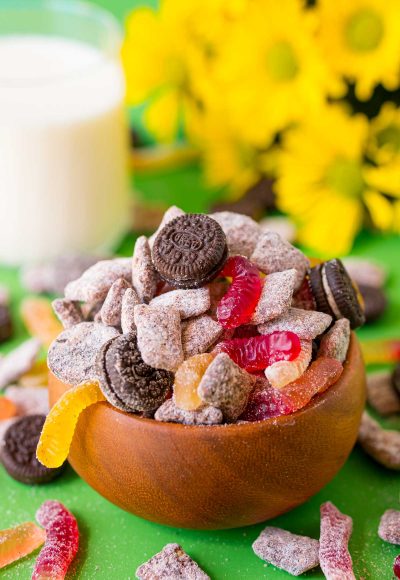 Close up photo of a wooden bowl with dirt cake muddy buddies in it.