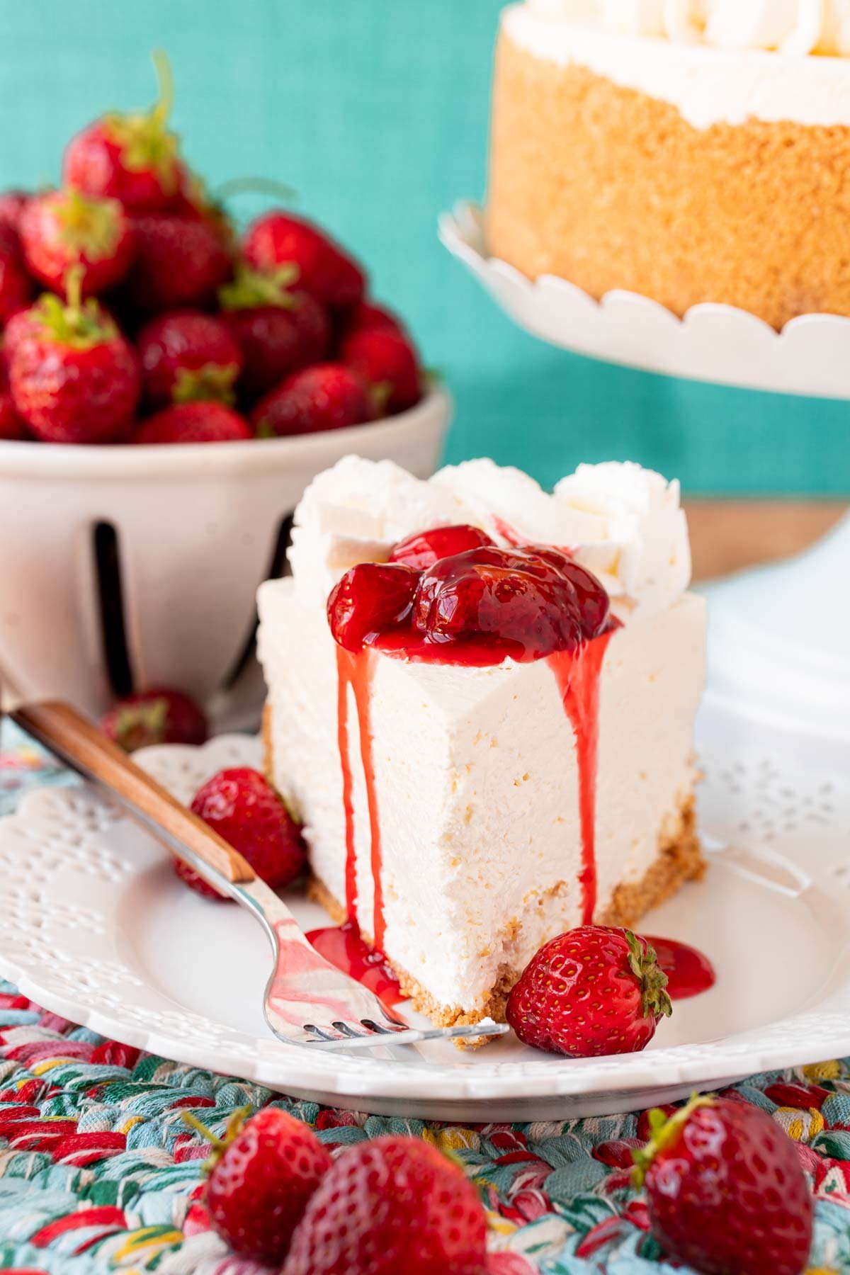 A slice of no bake cheesecake on a white plate.