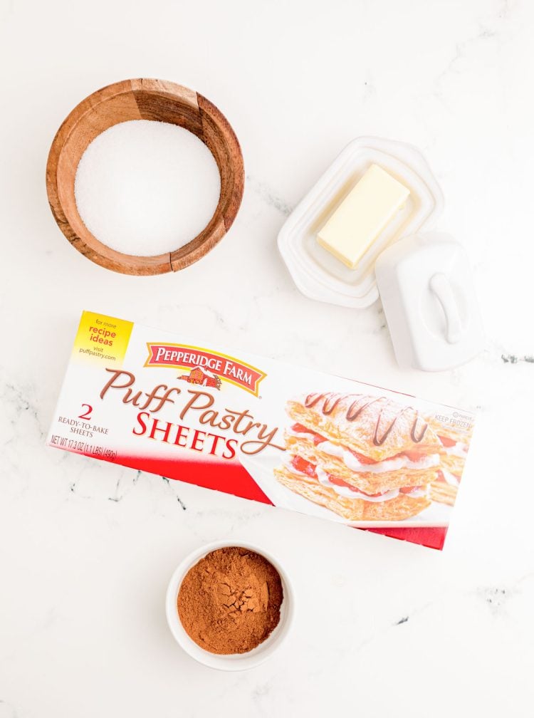 Ingredients to make homemade cruffins on a marble surface.