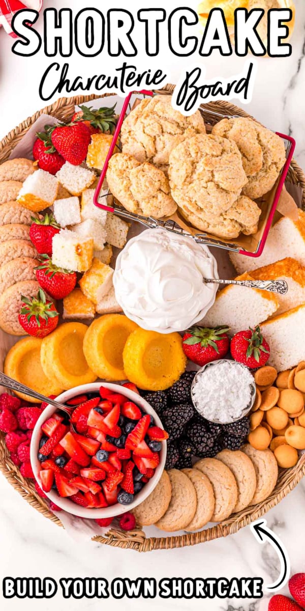 Shortcake Charcuterie Board is a delicious Build Your Own Shortcake experience that friends and family will have a ton of fun enjoying! Loaded with fresh fruit, cookies, whipped cream, and cake! via @sugarandsoulco