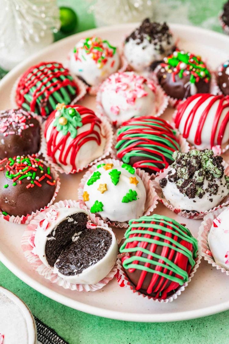 Christmas Oreo Balls on a white plate.