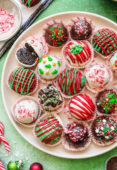 Overhead photo of Christmas decorated Oreo Balls on a white plate.