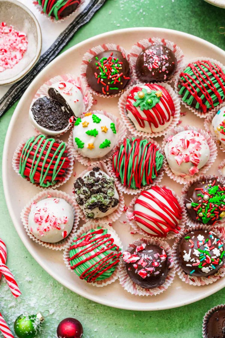 Overhead photo of Christmas decorated Oreo Balls on a white plate.