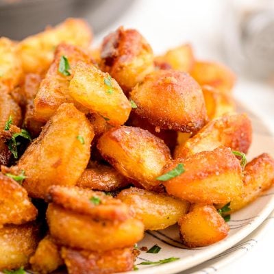 Crispy duck fat potatoes on a plate.