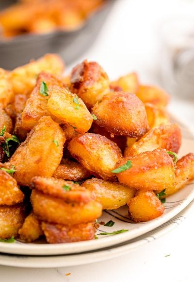 Crispy duck fat potatoes on a plate.