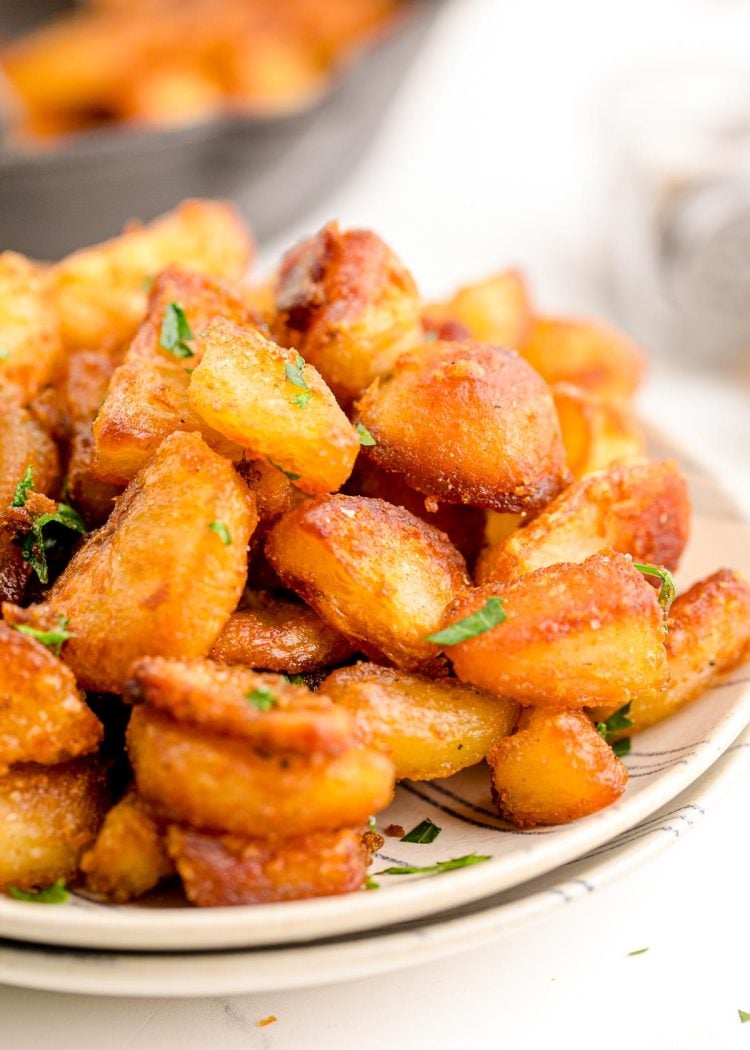 Crispy duck fat potatoes on a plate.