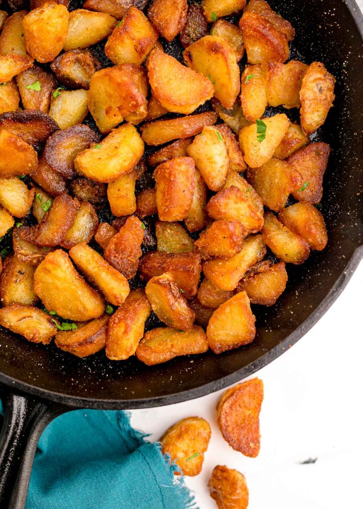 Duck fat potatoes in cast iron skillet.