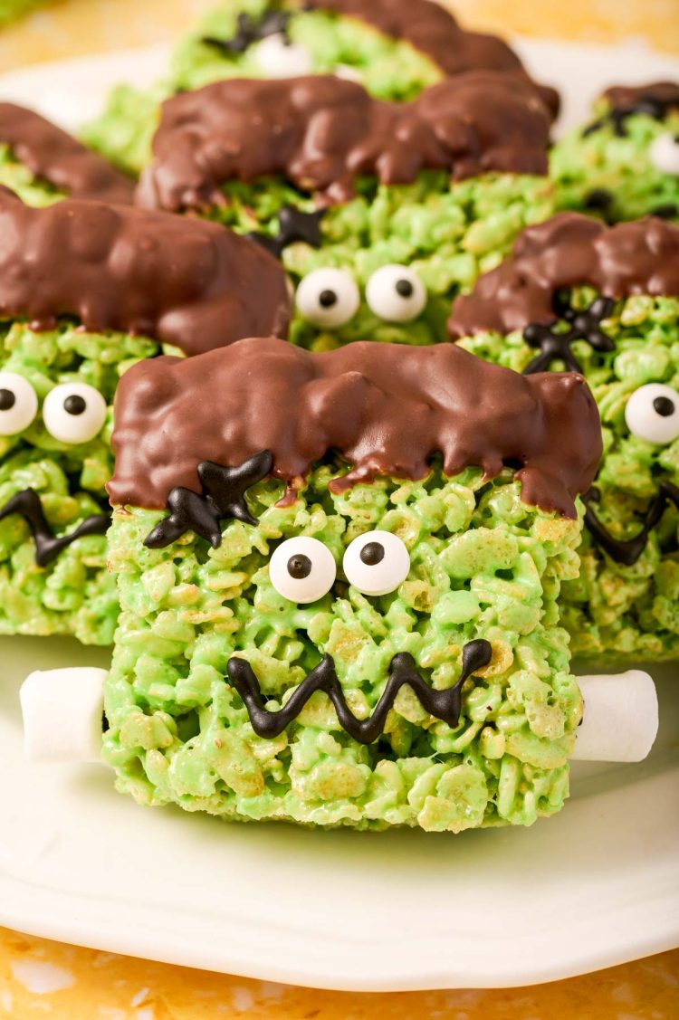 Close up of Frankenstein decorated Rice Krispie Treats on a white plate.