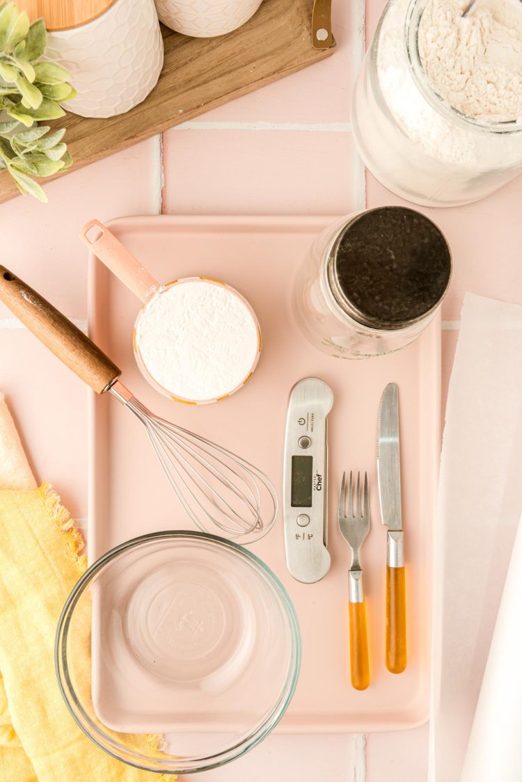 Tools needed to heat treat flour on a counter.