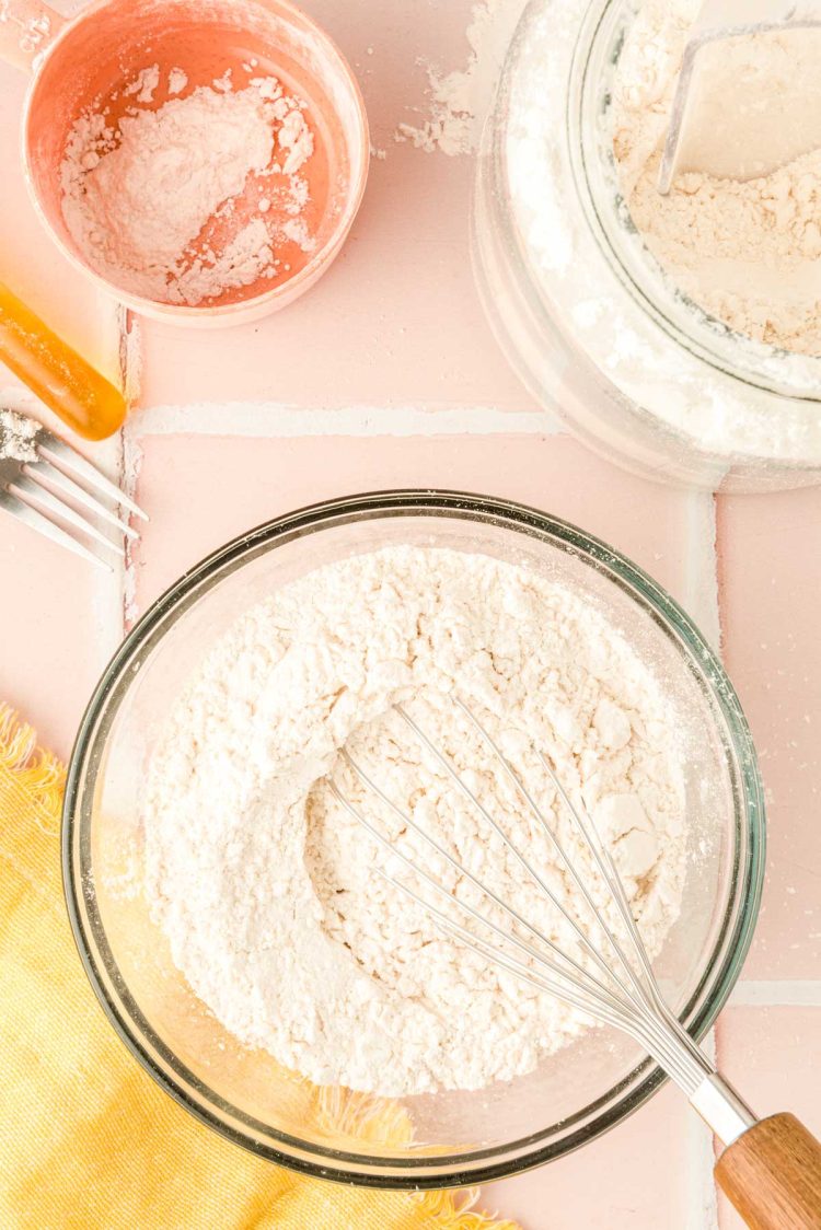 Flour in a bowl being whisked.