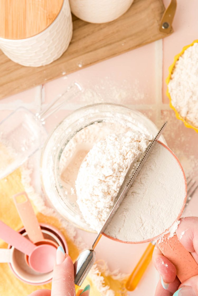 Spoon and sweep method being shown for measuring flour properly.